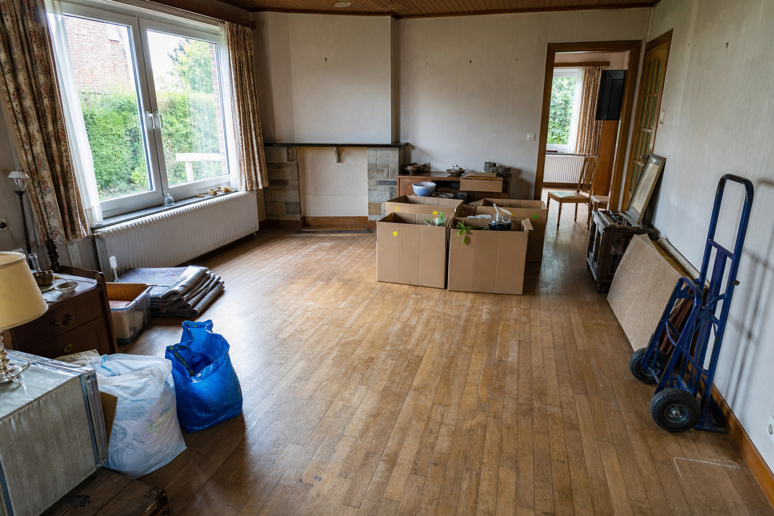 Débarras après départ en maison de repos à Waasmunster : avant, en cours et après — intervention en cours
